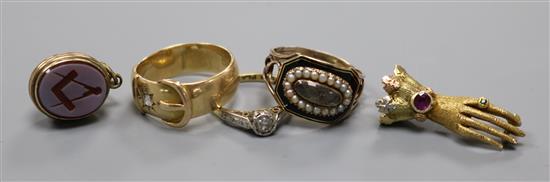 A George III yellow metal, seed pearl and enamel mourning ring, two other diamond rings, a bloodstone fob pendant and hand clasp.